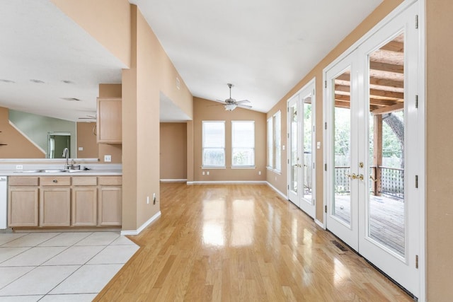 11978 Dorsett Rd, Austin, TX 78727 - kitchen with light wood-style floors, a ceiling fan, light brown cabinets, french doors, and light countertops