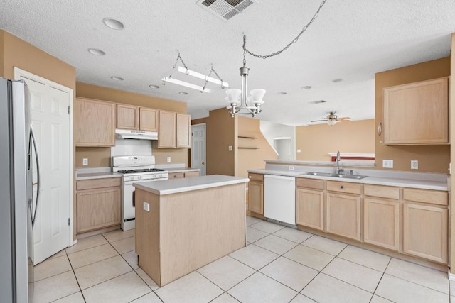 11978 Dorsett Rd, Austin, TX 78727 - kitchen featuring white appliances, light brown cabinets, under cabinet range hood, a ceiling fan, and a textured ceiling