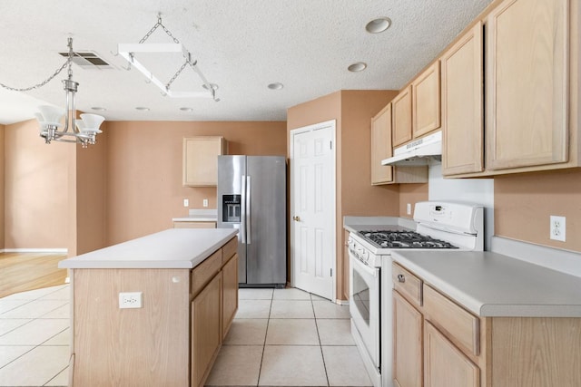 11978 Dorsett Rd, Austin, TX 78727 - kitchen featuring stainless steel fridge with ice dispenser, white gas range oven, light brown cabinets, under cabinet range hood, and recessed lighting