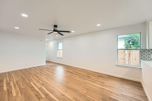16825 Hamilton Point Cir, Manor, TX 78653 - spare room with plenty of natural light, ceiling fan, recessed lighting, and light wood-style floors