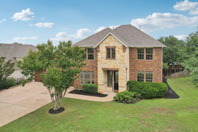 1508 Australis Cv, Austin, TX 78732 - view of front of house with stone siding, concrete driveway, a shingled roof, and brick siding