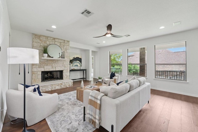 1508 Australis Cv, Austin, TX 78732 - living area with wood finished floors, a fireplace, and a ceiling fan