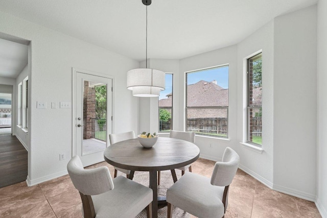 1508 Australis Cv, Austin, TX 78732 - dining space featuring plenty of natural light and light tile patterned floors
