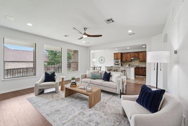 1508 Australis Cv, Austin, TX 78732 - living area featuring light wood-style floors, ceiling fan, and recessed lighting