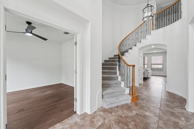 1508 Australis Cv, Austin, TX 78732 - foyer with stairs, ceiling fan, a towering ceiling, and arched walkways
