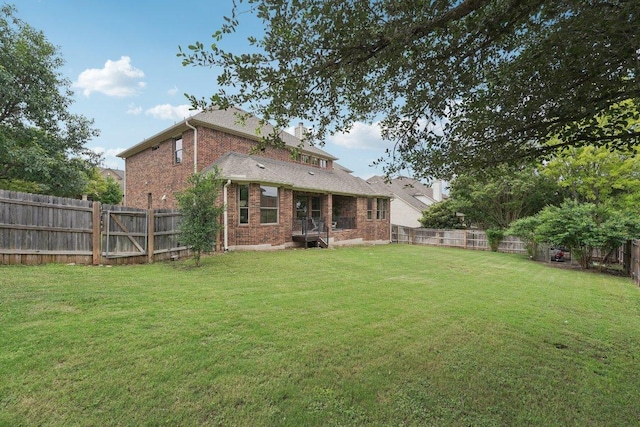 1508 Australis Cv, Austin, TX 78732 - rear view of property featuring brick siding and a fenced backyard