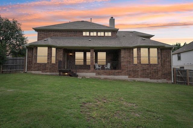 1508 Australis Cv, Austin, TX 78732 - back of house with brick siding, a fenced backyard, a chimney, and a shingled roof