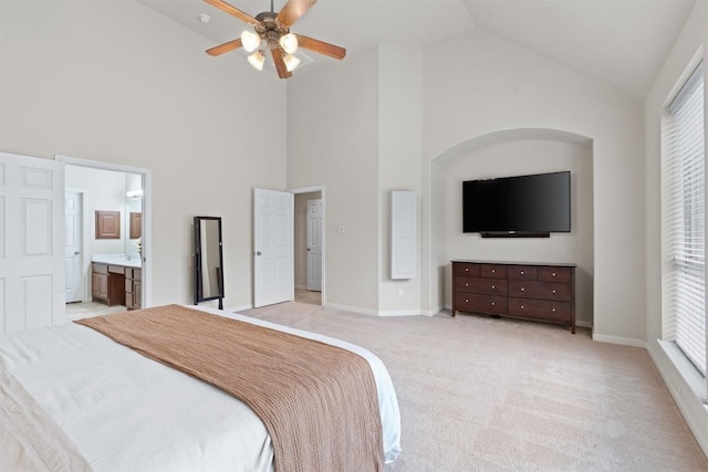 11404 Terrace Meadow Way, Manor, TX 78653 - bedroom with high vaulted ceiling, light colored carpet, multiple windows, ensuite bath, and a ceiling fan