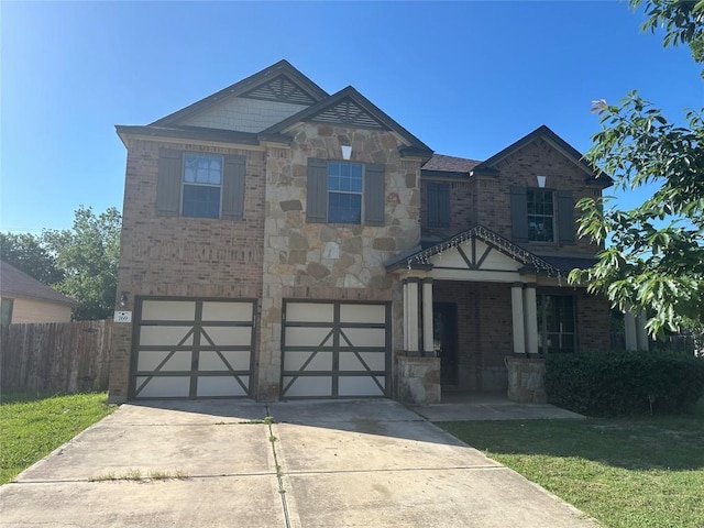 769 Apricot Dr, Kyle, TX 78640 - view of front of home featuring brick siding, an attached garage, concrete driveway, and stone siding