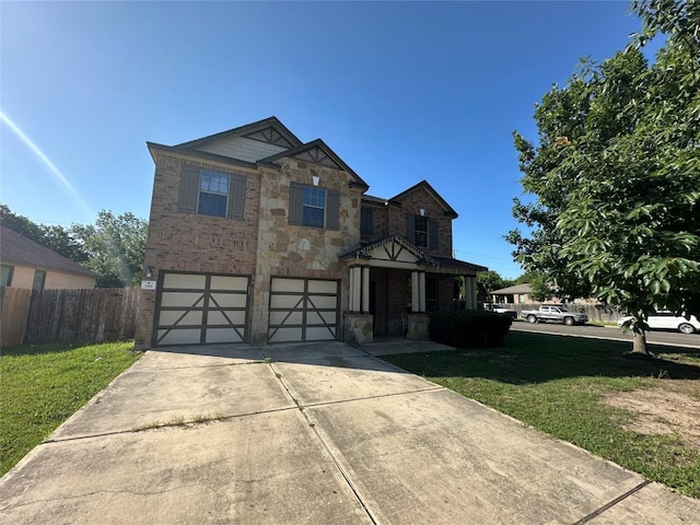 769 Apricot Dr, Kyle, TX 78640 - craftsman inspired home with a garage, driveway, stone siding, and brick siding
