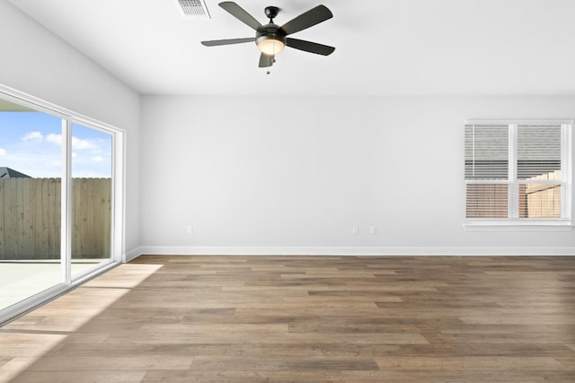 9317 Gladsome Path, Manor, TX 78653 - spare room featuring ceiling fan and wood finished floors