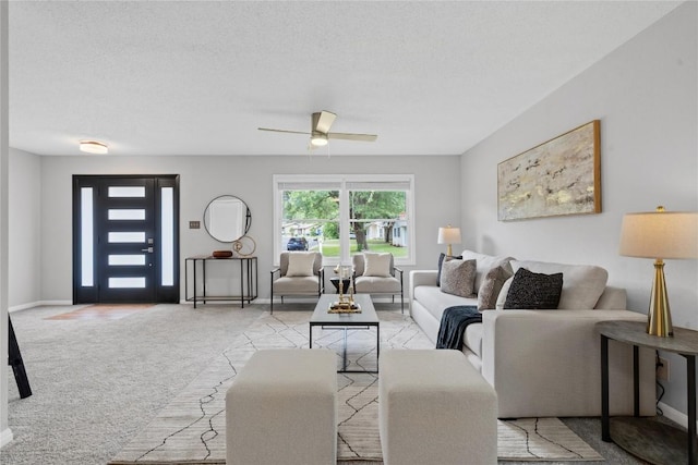 5317 Harvest Ln, Austin, TX 78745 - living area featuring light colored carpet, a ceiling fan, and a textured ceiling