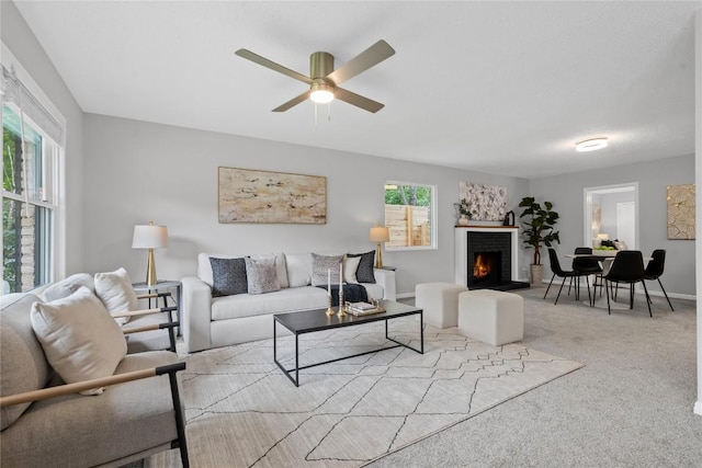 5317 Harvest Ln, Austin, TX 78745 - carpeted living area featuring ceiling fan and a fireplace