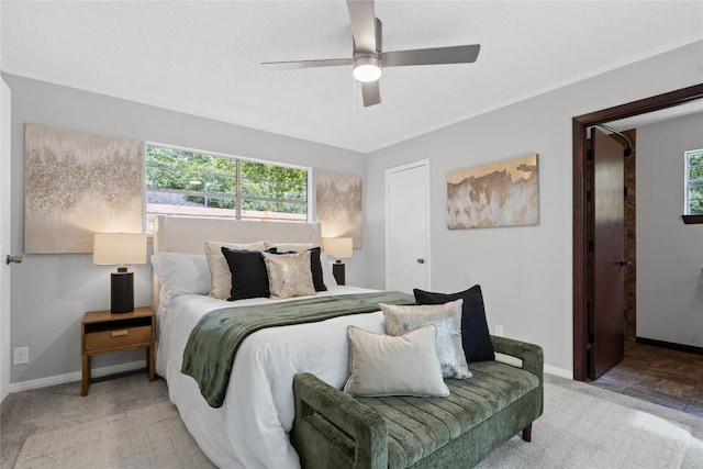 5317 Harvest Ln, Austin, TX 78745 - bedroom featuring multiple windows, carpet flooring, and a ceiling fan