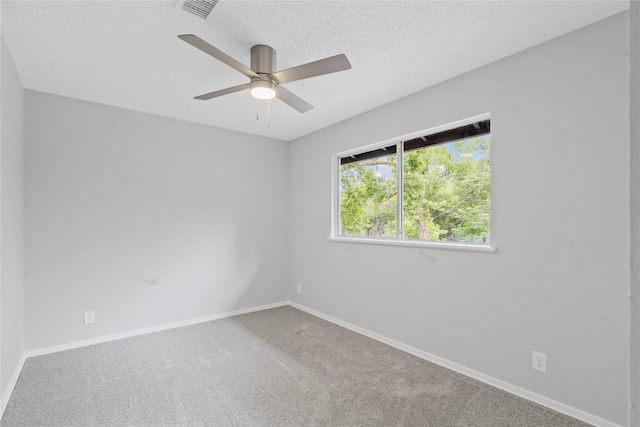 5317 Harvest Ln, Austin, TX 78745 - spare room featuring carpet flooring, ceiling fan, and a textured ceiling