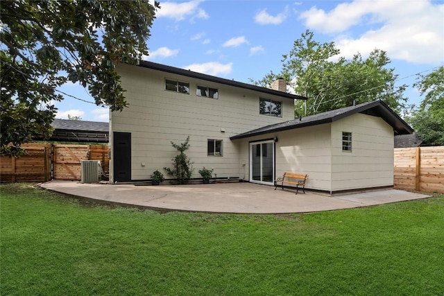 5317 Harvest Ln, Austin, TX 78745 - back of property with a chimney, a patio, and a gate