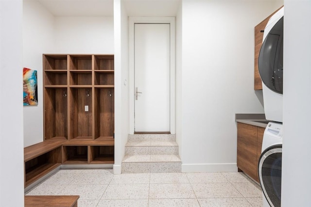 4103 Ridgelea Dr, Austin, TX 78731 - washroom with stacked washer and clothes dryer and cabinet space
