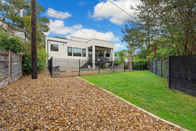 4103 Ridgelea Dr, Austin, TX 78731 - back of property featuring a fenced backyard and stucco siding