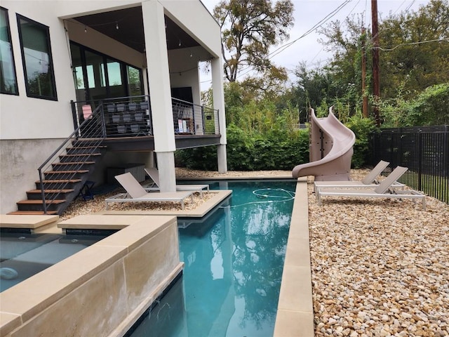 4103 Ridgelea Dr, Austin, TX 78731 - view of swimming pool featuring a water slide and stairs