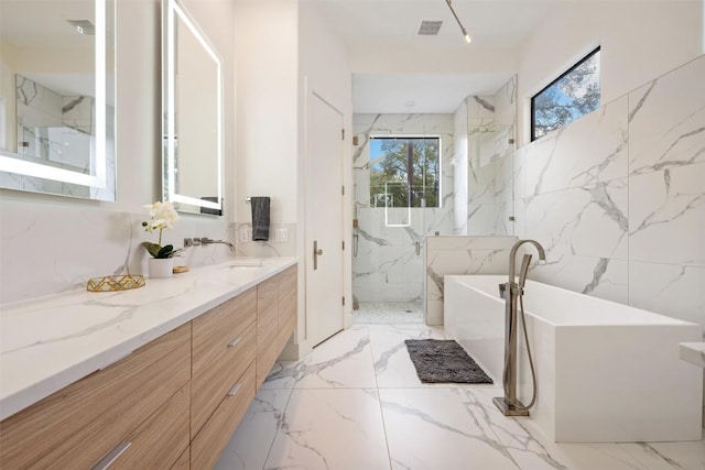 4103 Ridgelea Dr, Austin, TX 78731 - bathroom with marble tiled flooring, vanity, a freestanding tub, a marble finish shower, and tile walls