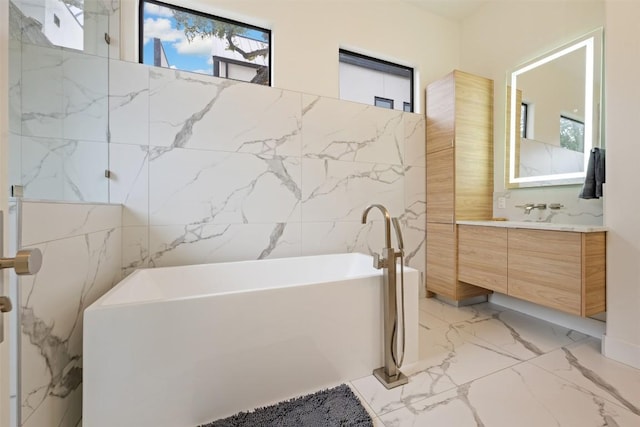 4103 Ridgelea Dr, Austin, TX 78731 - full bathroom featuring marble tiled floors, vanity, and a freestanding bath