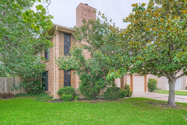12711 Possum Hollow Dr, Austin, TX 78729 - view of front of house with driveway, a chimney, brick siding, and an attached garage