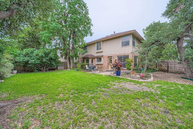 12711 Possum Hollow Dr, Austin, TX 78729 - back of property with a patio area, a fenced backyard, and brick siding
