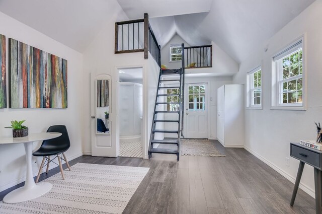 2702 Bonnie Rd, Austin, TX 78703 - foyer featuring wood finished floors, stairway, and high vaulted ceiling