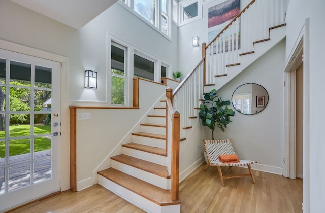 2702 Bonnie Rd, Austin, TX 78703 - stairs with wood finished floors and baseboards
