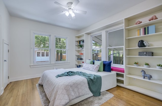 2702 Bonnie Rd, Austin, TX 78703 - bedroom featuring wood finished floors and ceiling fan