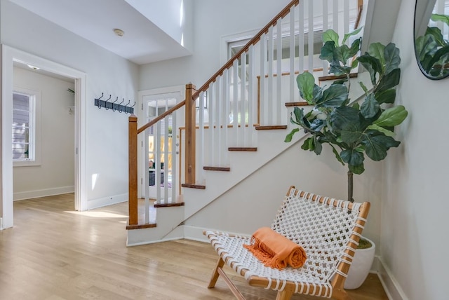 2702 Bonnie Rd, Austin, TX 78703 - stairs with wood finished floors and baseboards