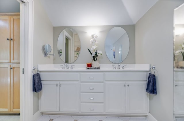 2702 Bonnie Rd, Austin, TX 78703 - full bathroom with double vanity, lofted ceiling, and tile patterned floors