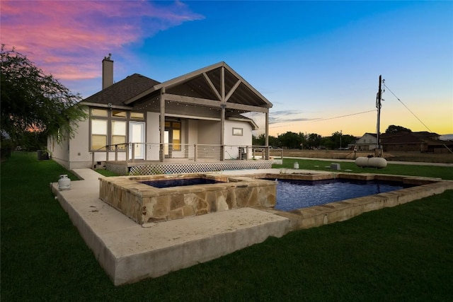 212 Ferryboat Ln, New Braunfels, TX 78130 - rear view of house featuring a yard, a chimney, stucco siding, and a deck