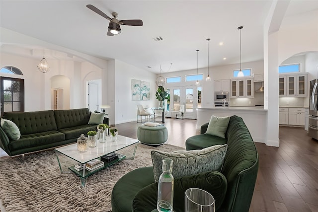 212 Ferryboat Ln, New Braunfels, TX 78130 - living room featuring ceiling fan, arched walkways, dark wood-type flooring, and recessed lighting