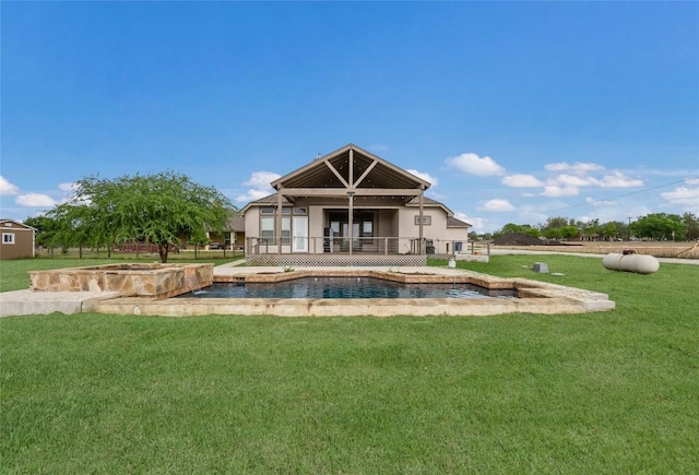 212 Ferryboat Ln, New Braunfels, TX 78130 - back of property with a lawn, stucco siding, and a pool with connected hot tub