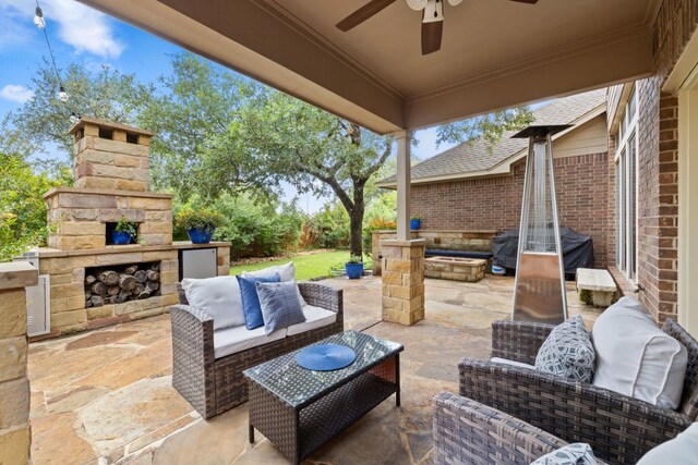1802 Tall Chief, Leander, TX 78641 - view of patio with an outdoor living space with a fireplace, ceiling fan, and grilling area