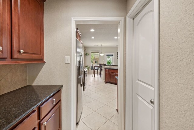 1802 Tall Chief, Leander, TX 78641 - hall featuring a textured wall, light tile patterned floors, and recessed lighting