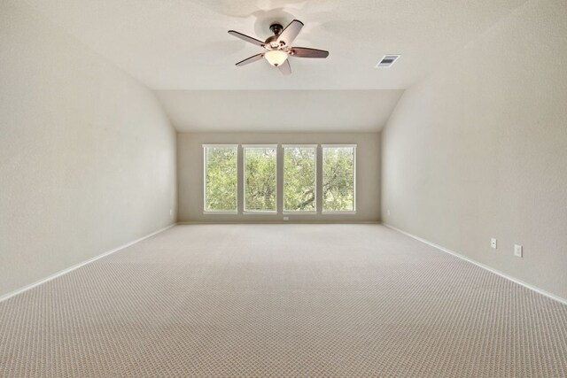 1802 Tall Chief, Leander, TX 78641 - unfurnished room with light colored carpet, vaulted ceiling, and ceiling fan