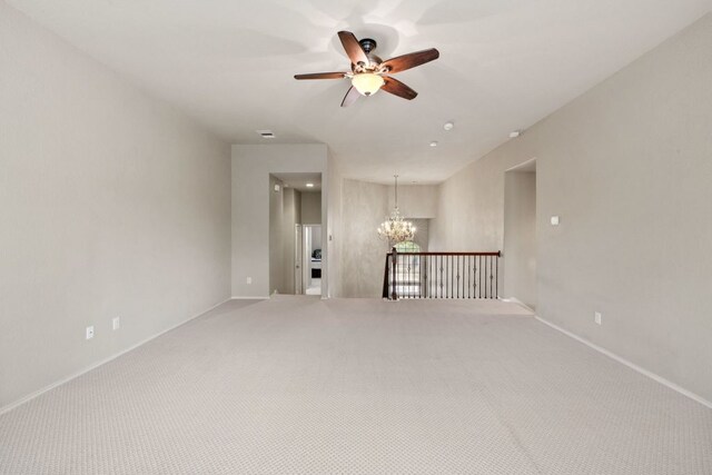 1802 Tall Chief, Leander, TX 78641 - unfurnished room featuring a chandelier, ceiling fan, and carpet flooring