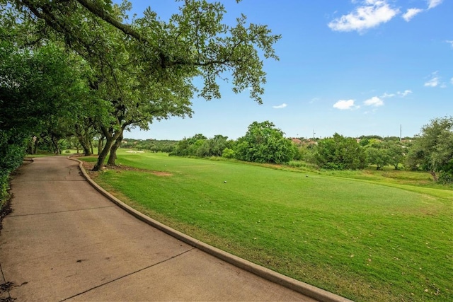 4605 Bat Falcon Dr, Austin, TX 78738 - view of community with a yard and view of wooded area