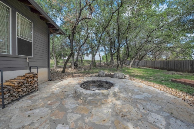 2705 Pyramid Dr, Austin, TX 78734 - fenced backyard featuring an outdoor fire pit and a patio area