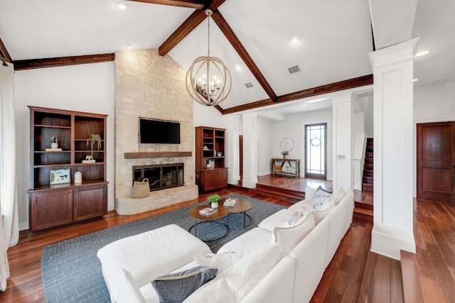 2705 Pyramid Dr, Austin, TX 78734 - living area featuring beam ceiling, wood finished floors, decorative columns, a fireplace, and a chandelier