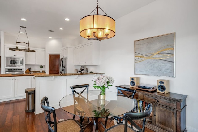 2705 Pyramid Dr, Austin, TX 78734 - dining space with dark wood-style flooring, recessed lighting, and a chandelier