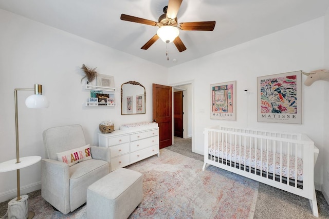 2705 Pyramid Dr, Austin, TX 78734 - bedroom featuring light colored carpet, a crib, and a ceiling fan