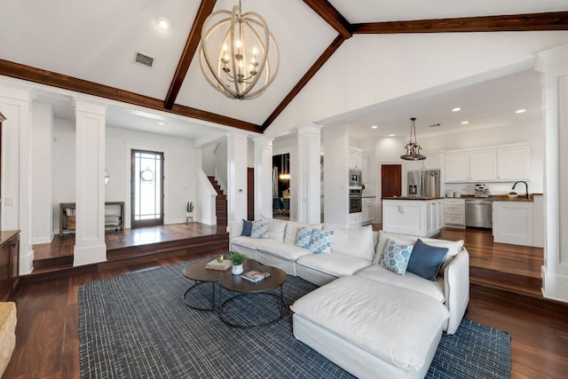 2705 Pyramid Dr, Austin, TX 78734 - living room featuring decorative columns, high vaulted ceiling, beam ceiling, dark wood-type flooring, and a chandelier