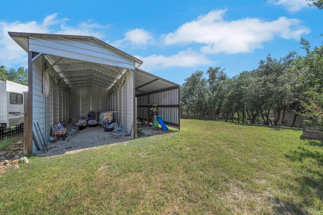 2705 Pyramid Dr, Austin, TX 78734 - view of green lawn featuring a carport and a pole building