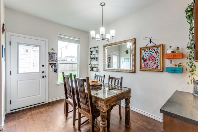 18701 Golden Eagle Way, Elgin, TX 78621 - dining room with a chandelier and dark wood-style floors