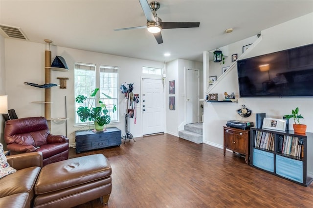 18701 Golden Eagle Way, Elgin, TX 78621 - living area featuring stairway, wood finished floors, and a ceiling fan