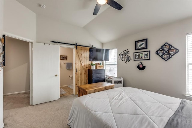 18701 Golden Eagle Way, Elgin, TX 78621 - carpeted bedroom featuring a barn door, lofted ceiling, ensuite bath, and a ceiling fan