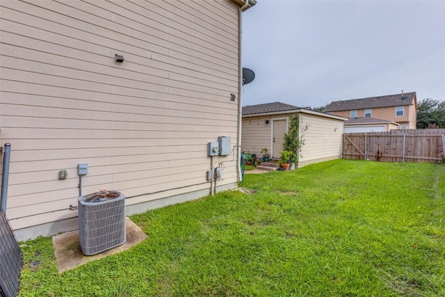 18701 Golden Eagle Way, Elgin, TX 78621 - fenced backyard with an outbuilding